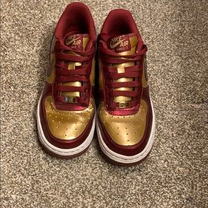 Nike Air Force One red and gold shoes